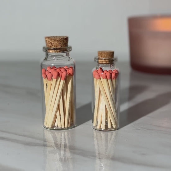 Orange safety matches. Matches in a glass bottle with cork cap